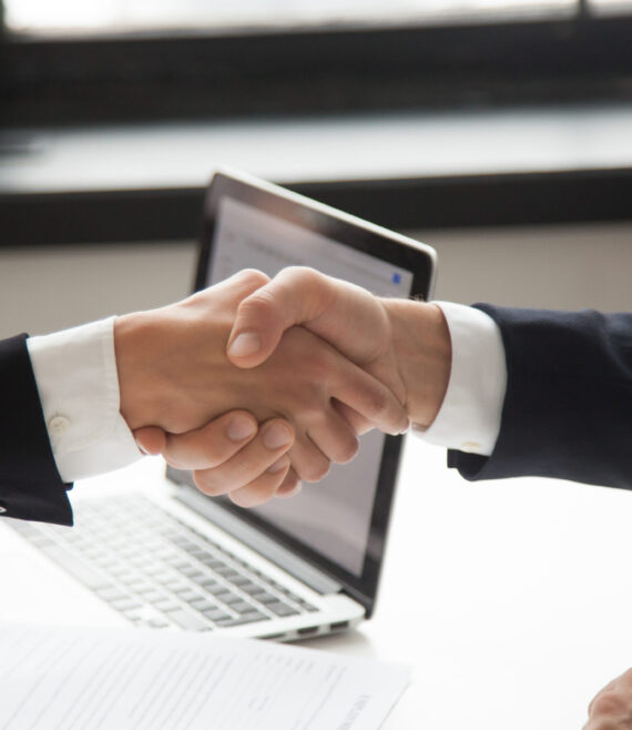 Businessman handshaking businesswoman showing respect, closeup v